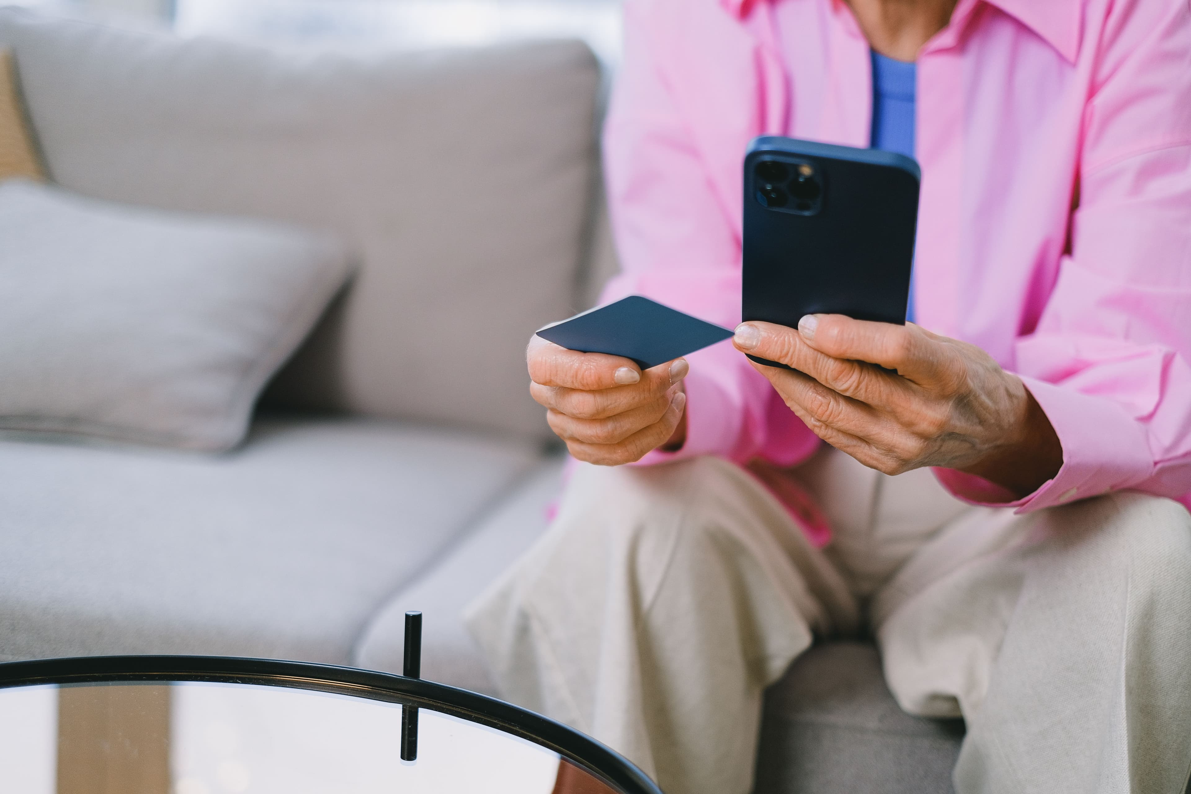 Close view of a person using a mobile payment device.
